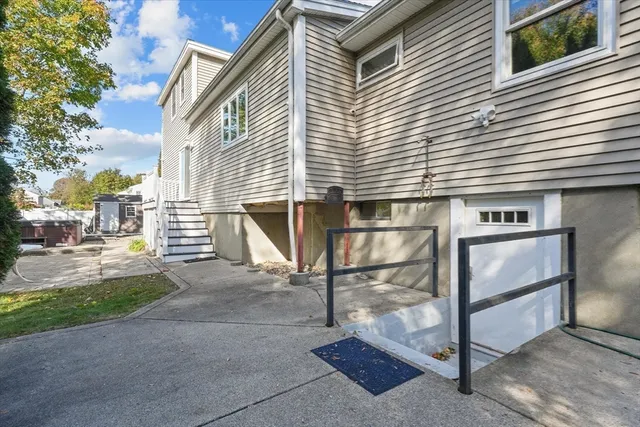 an aerial view of a house with a yard and furniture