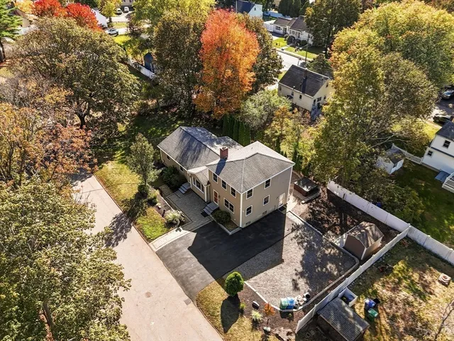 an aerial view of residential houses with outdoor space