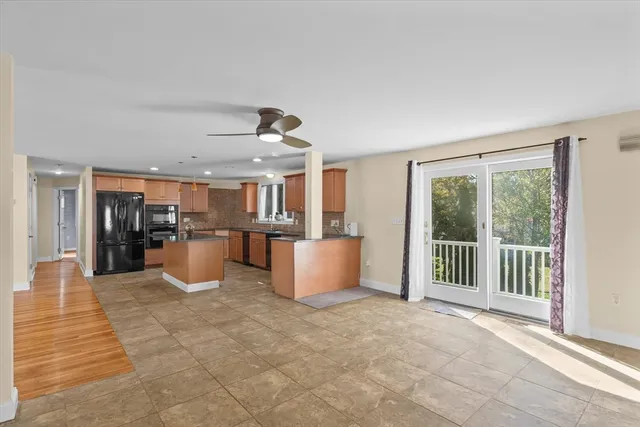 a view of kitchen with furniture and windows