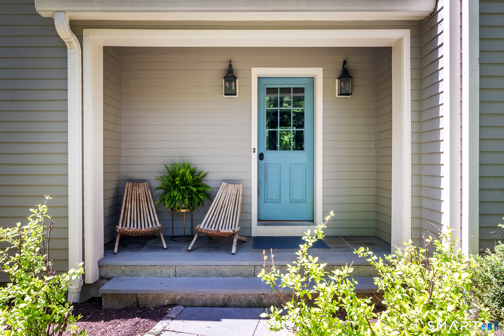 33 Hunter Lane Ridgefield, CT 06877 - Photo 3 of 39 a view of front door and potted plants