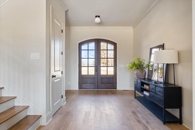 a kitchen with stainless steel appliances granite countertop a stove and cabinets