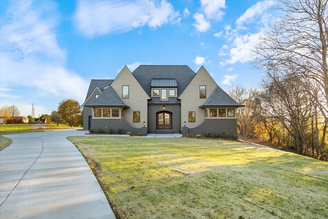 a front view of a house with a yard