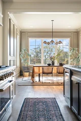 a spacious bathroom with a granite countertop sink and a mirror
