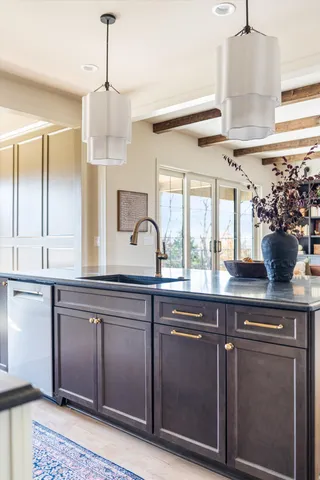 a spacious bathroom with a double vanity sink and a mirror