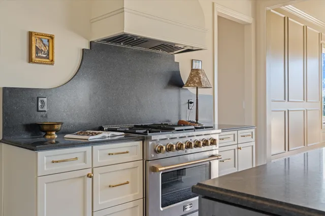 a bathroom with a tub shower and mirror