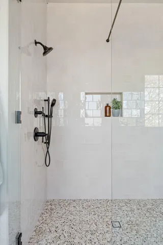a kitchen with stainless steel appliances granite countertop a sink and a stove next to a window