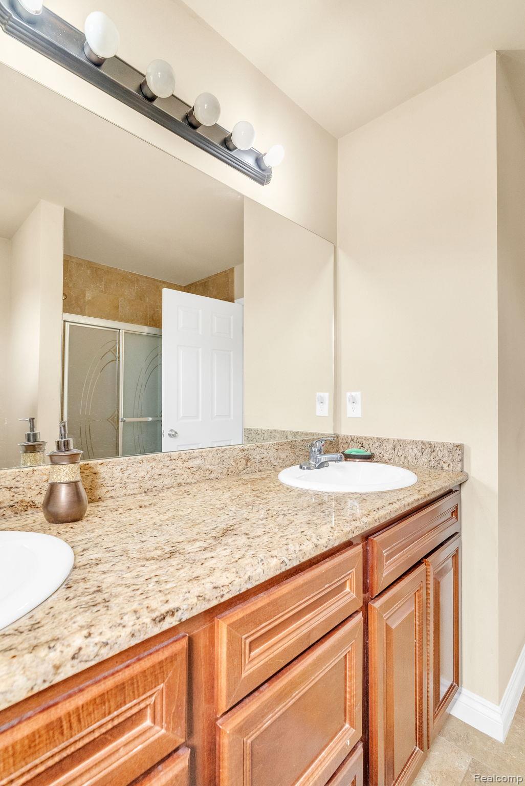 4122 Hawks Nest Road Utica, MI 48317 - Photo 53 of 74 Full bath with double vanity and a stall shower