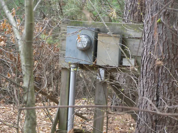 a roof deck with table and chairs and couches