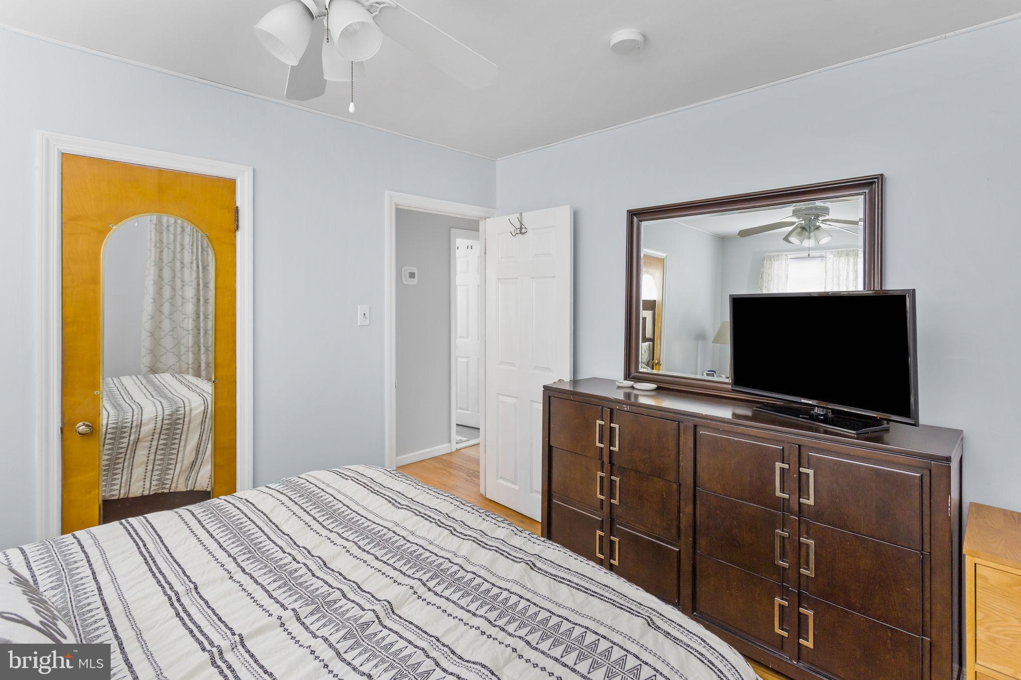 29 West Broadway Maple Shade, NJ 08052 - Photo 24 of 35 a bedroom with a bed and a flat tv screen on dresser