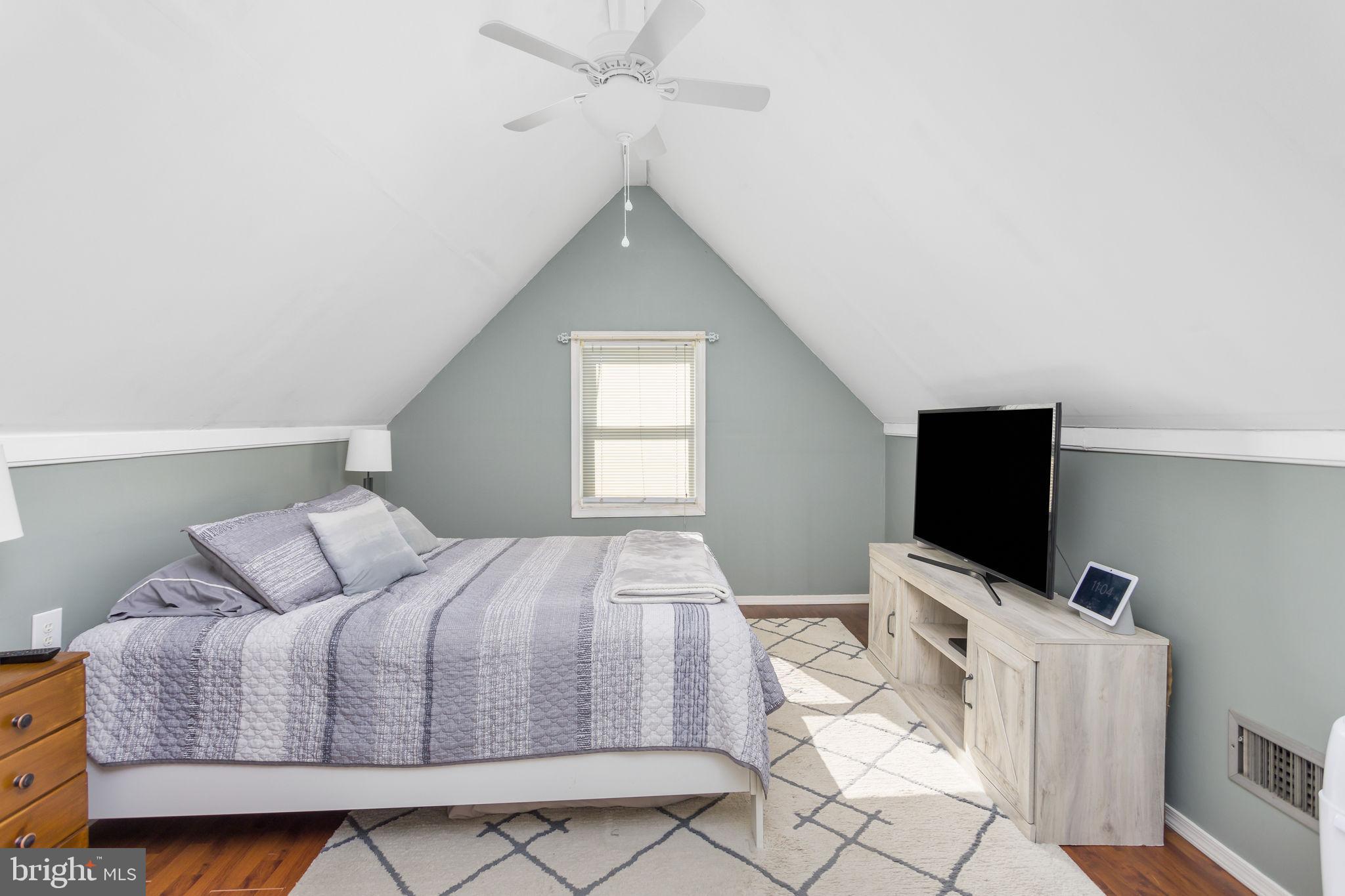 29 West Broadway Maple Shade, NJ 08052 - Photo 25 of 35 a bedroom with a bed and a flat screen tv
