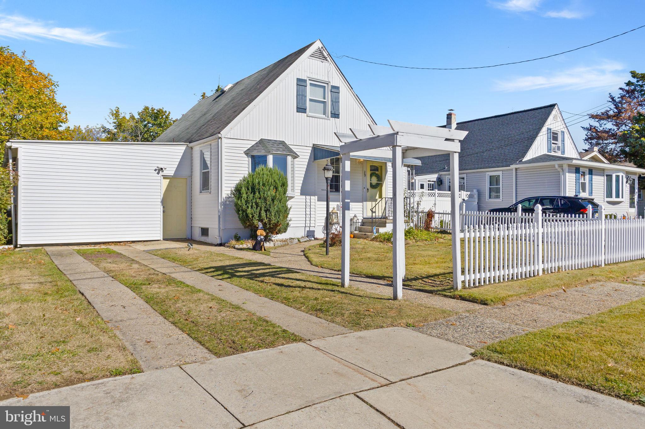 29 West Broadway Maple Shade, NJ 08052 - Photo 4 of 35 a front view of a house with a yard