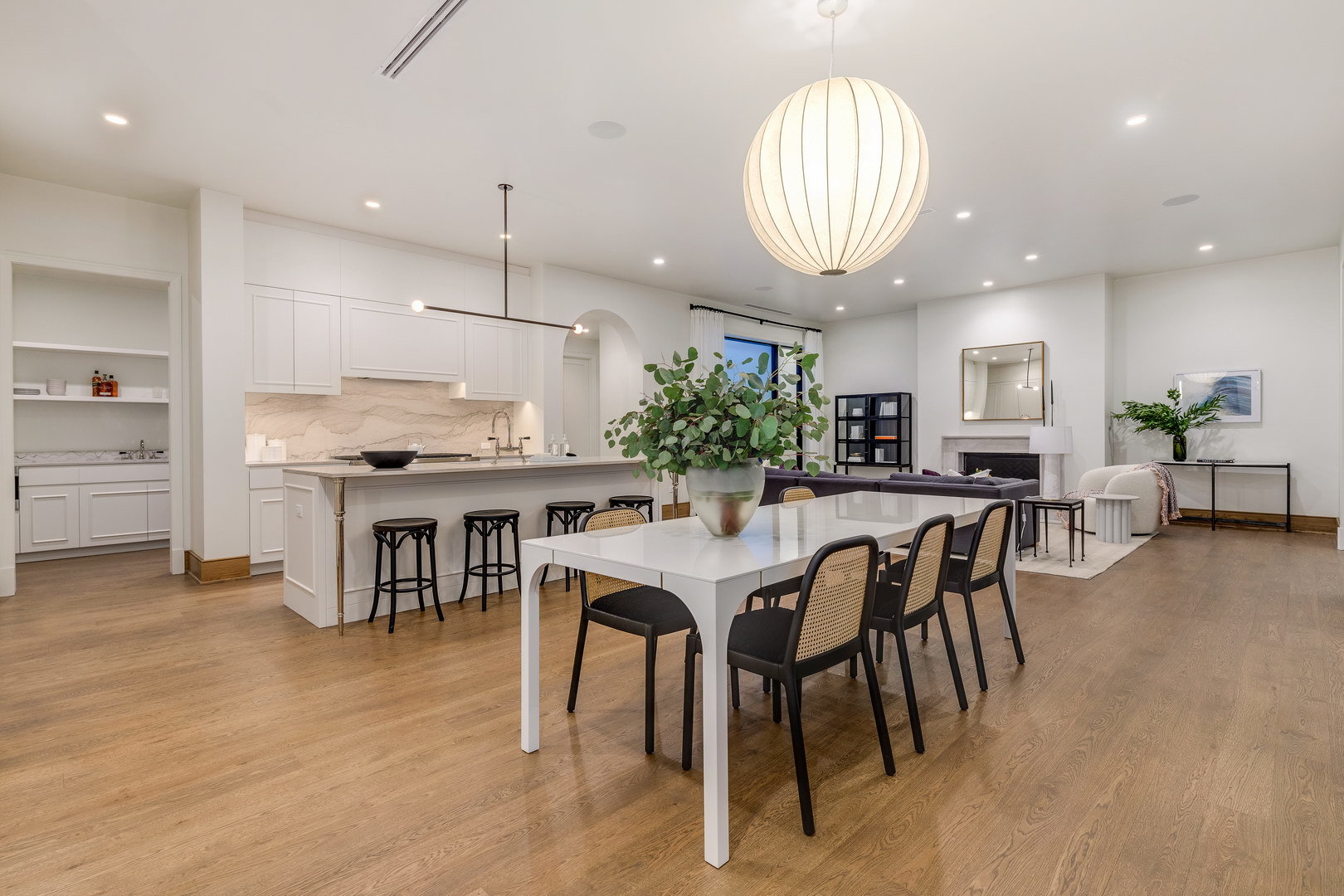 21 North May Street, Unit 504 Chicago, IL 60607 - Photo 7 of 25 an open kitchen with dining table and chairs