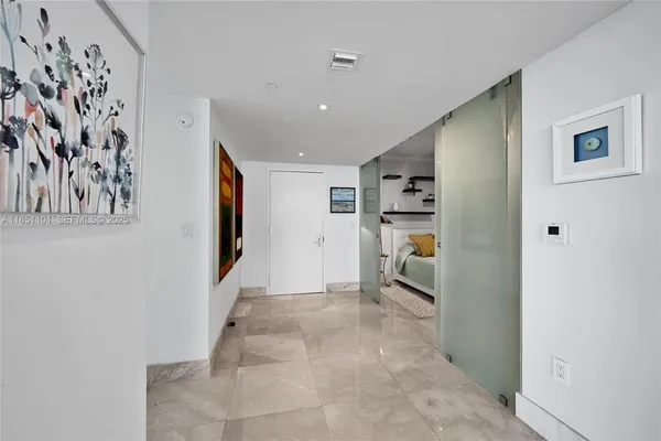 a view of a hallway with wooden shelves