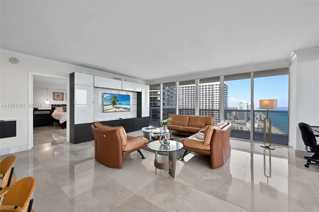 a living room with furniture and a large window