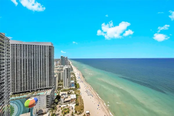 a view of a chairs and table in the balcony