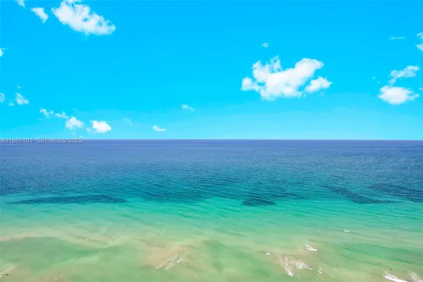 a room with furniture and a chandelier