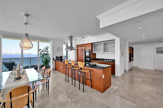 a kitchen with stainless steel appliances granite countertop a stove and a refrigerator