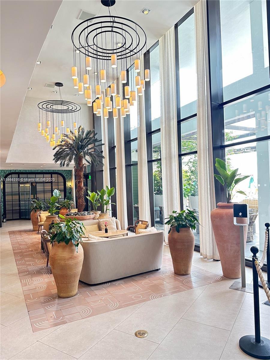 1100 West Avenue, Unit 1402 Miami Beach, FL 33139 - Photo 19 of 58 a living room with furniture and a potted plant