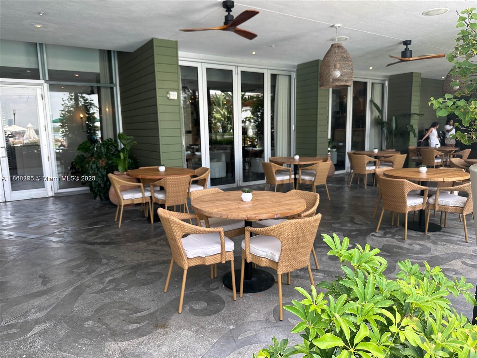 1100 West Avenue, Unit 1402 Miami Beach, FL 33139 - Photo 21 of 58 a outdoor space with lots of tables and chairs