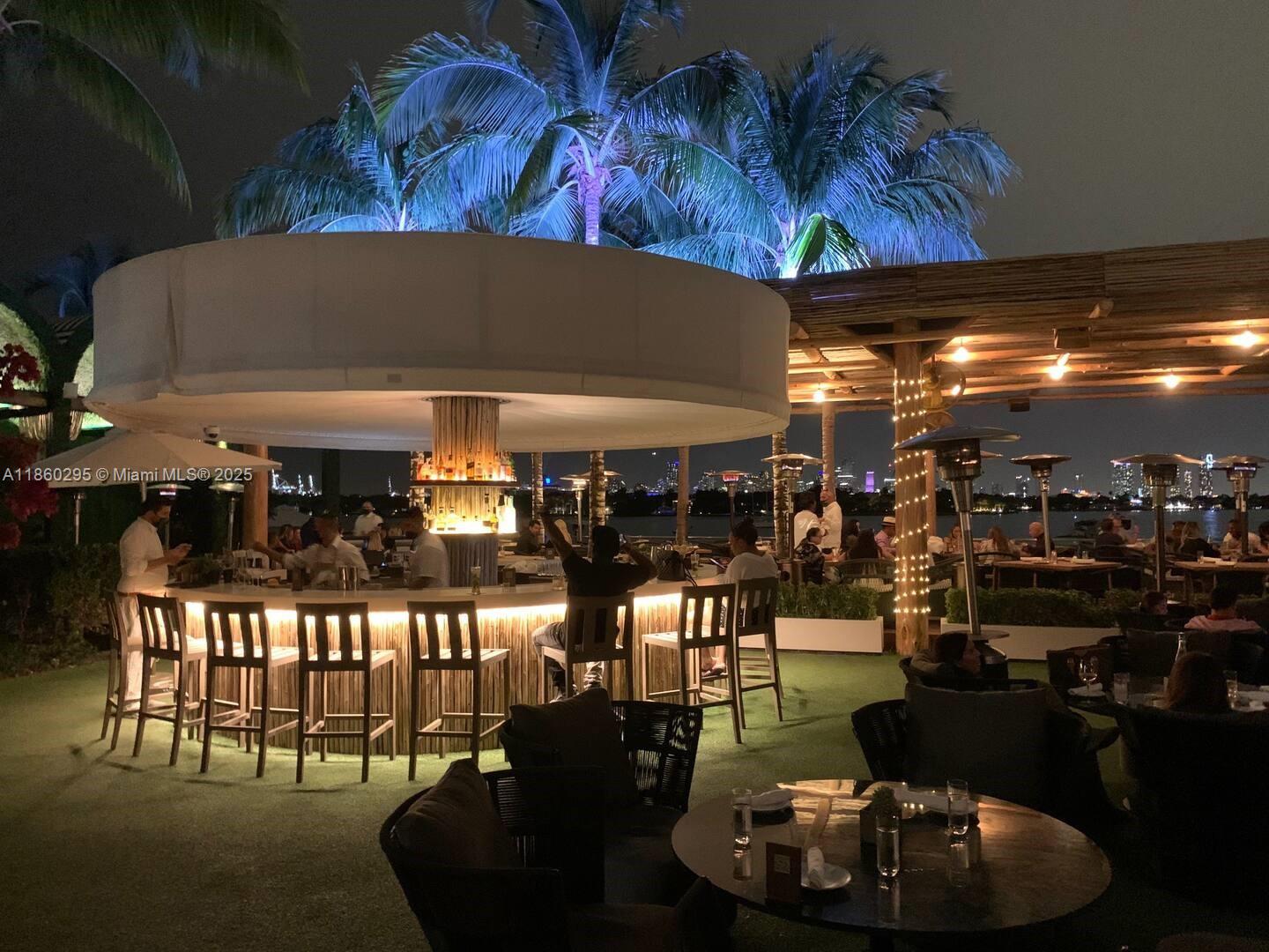 1100 West Avenue, Unit 1402 Miami Beach, FL 33139 - Photo 25 of 58 a room with lots of chairs and tables