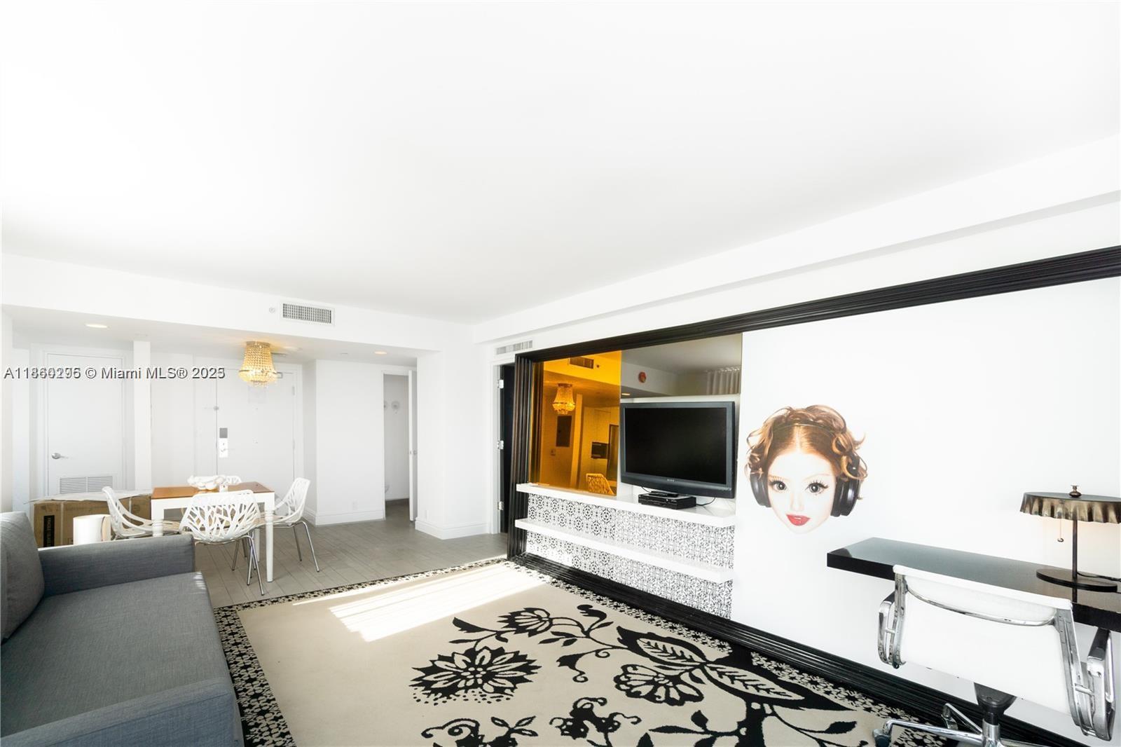 1100 West Avenue, Unit 1402 Miami Beach, FL 33139 - Photo 4 of 58 a living room with furniture window and lamp