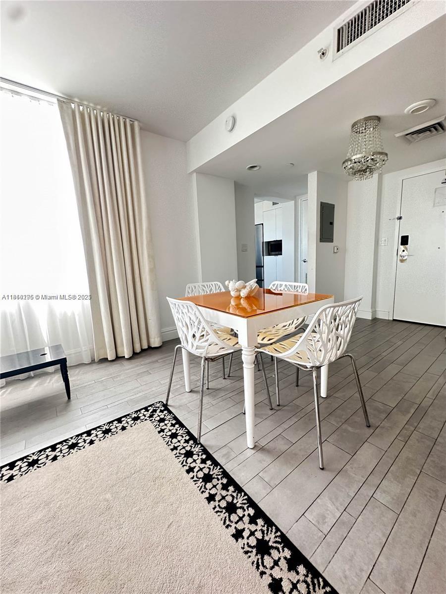 1100 West Avenue, Unit 1402 Miami Beach, FL 33139 - Photo 5 of 58 a outdoor space with a table and chairs