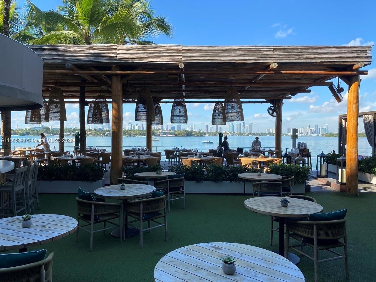 1100 West Avenue, Unit 1402 Miami Beach, FL 33139 - Photo 54 of 58 a living room with furniture and a floor to ceiling window