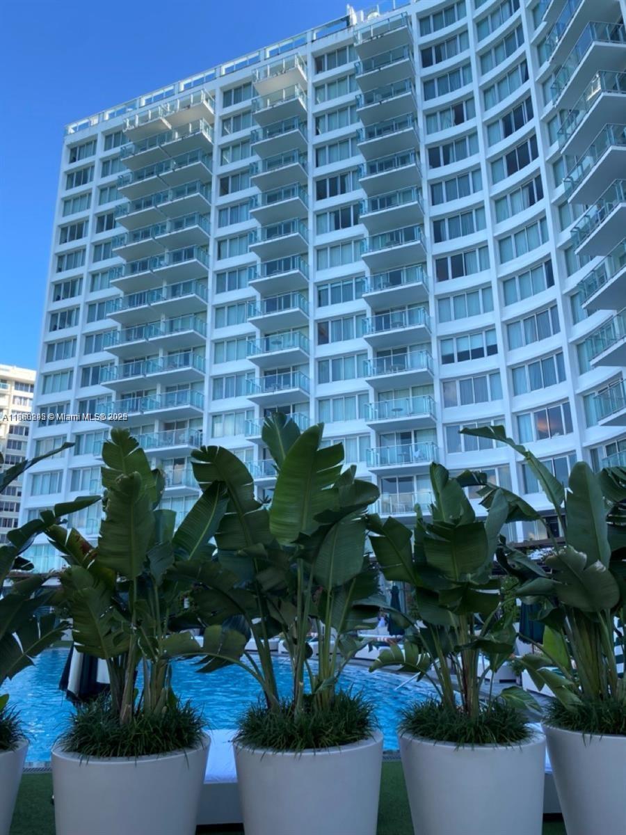 1100 West Avenue, Unit 1402 Miami Beach, FL 33139 - Photo 56 of 58 a vase of flowers sitting on a table