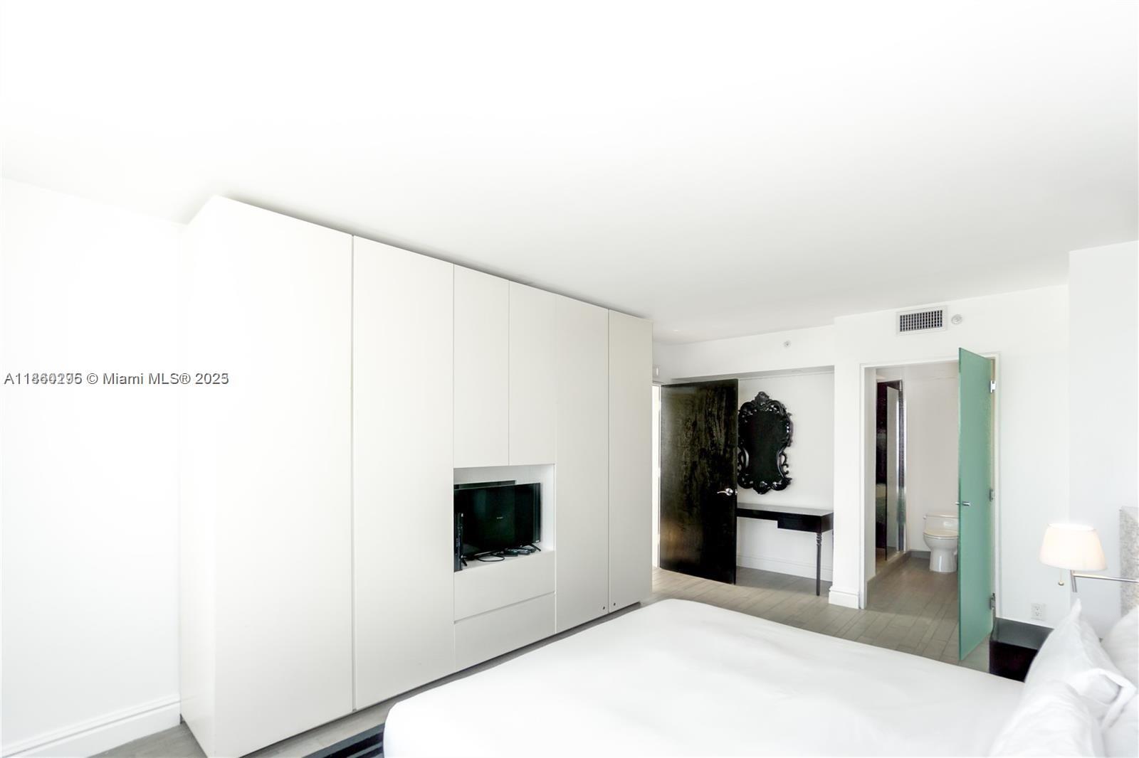 1100 West Avenue, Unit 1402 Miami Beach, FL 33139 - Photo 7 of 58 a view of kitchen with stainless steel appliances kitchen island sink refrigerator and stove