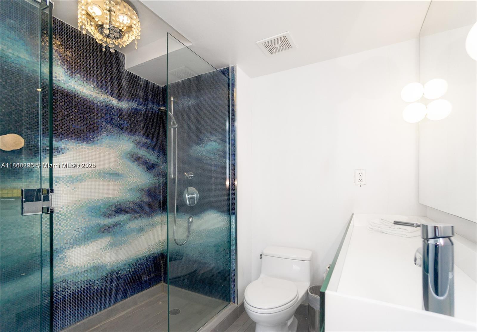 1100 West Avenue, Unit 1402 Miami Beach, FL 33139 - Photo 9 of 58 a bathroom with a toilet and a shower