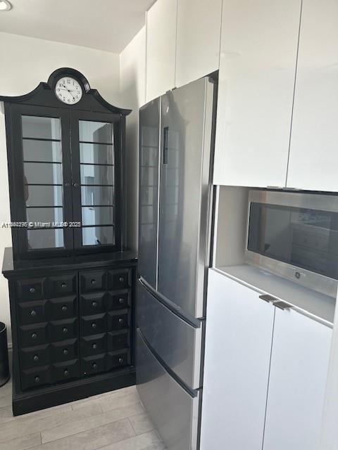 1100 West Avenue, Unit 1402 Miami Beach, FL 33139 - Photo 10 of 58 a kitchen with a refrigerator and a sink