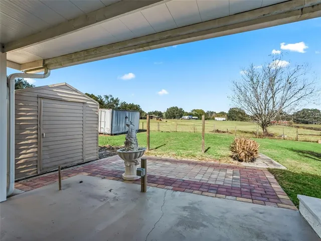 a view of a backyard with a patio