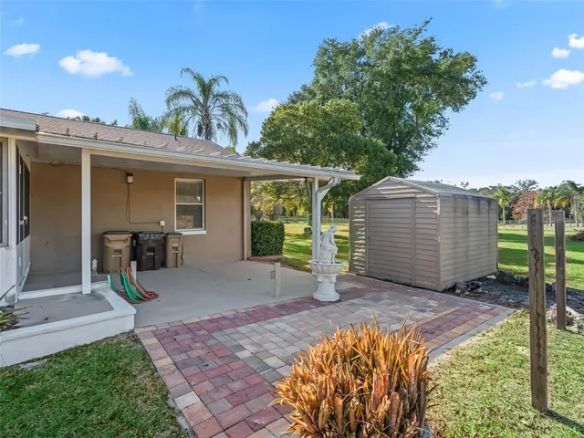 a house view with a sitting space and garden
