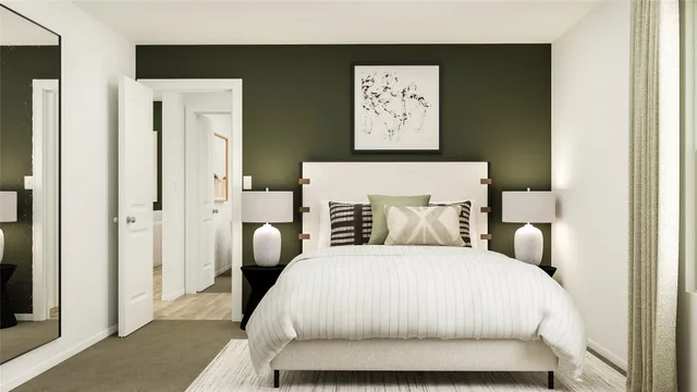 a bedroom with a bed and a painting on the wall