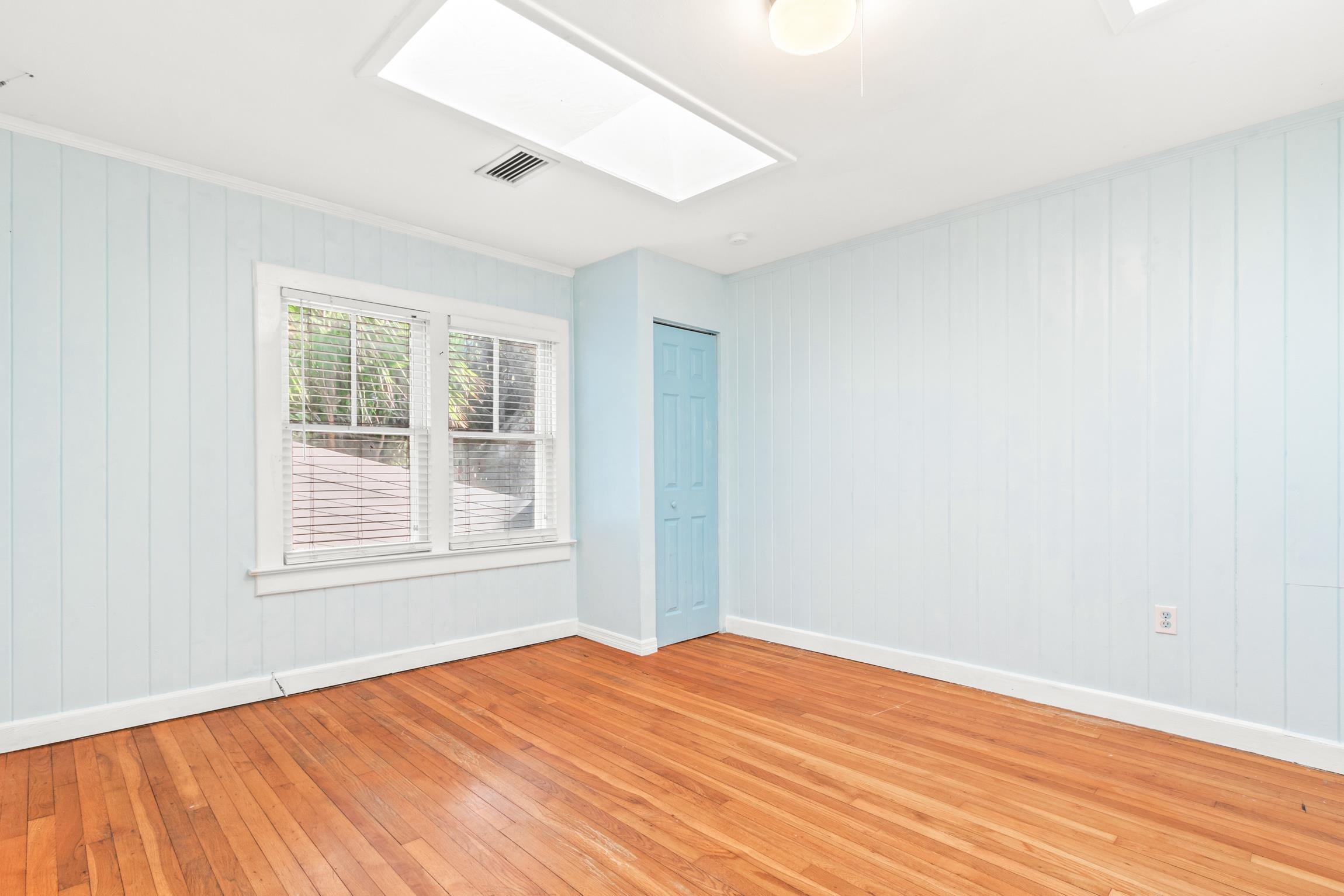 26 Ponce De Leon Avenue St. Augustine, FL 32080 - Photo 11 of 51 an empty room with wooden floor and windows