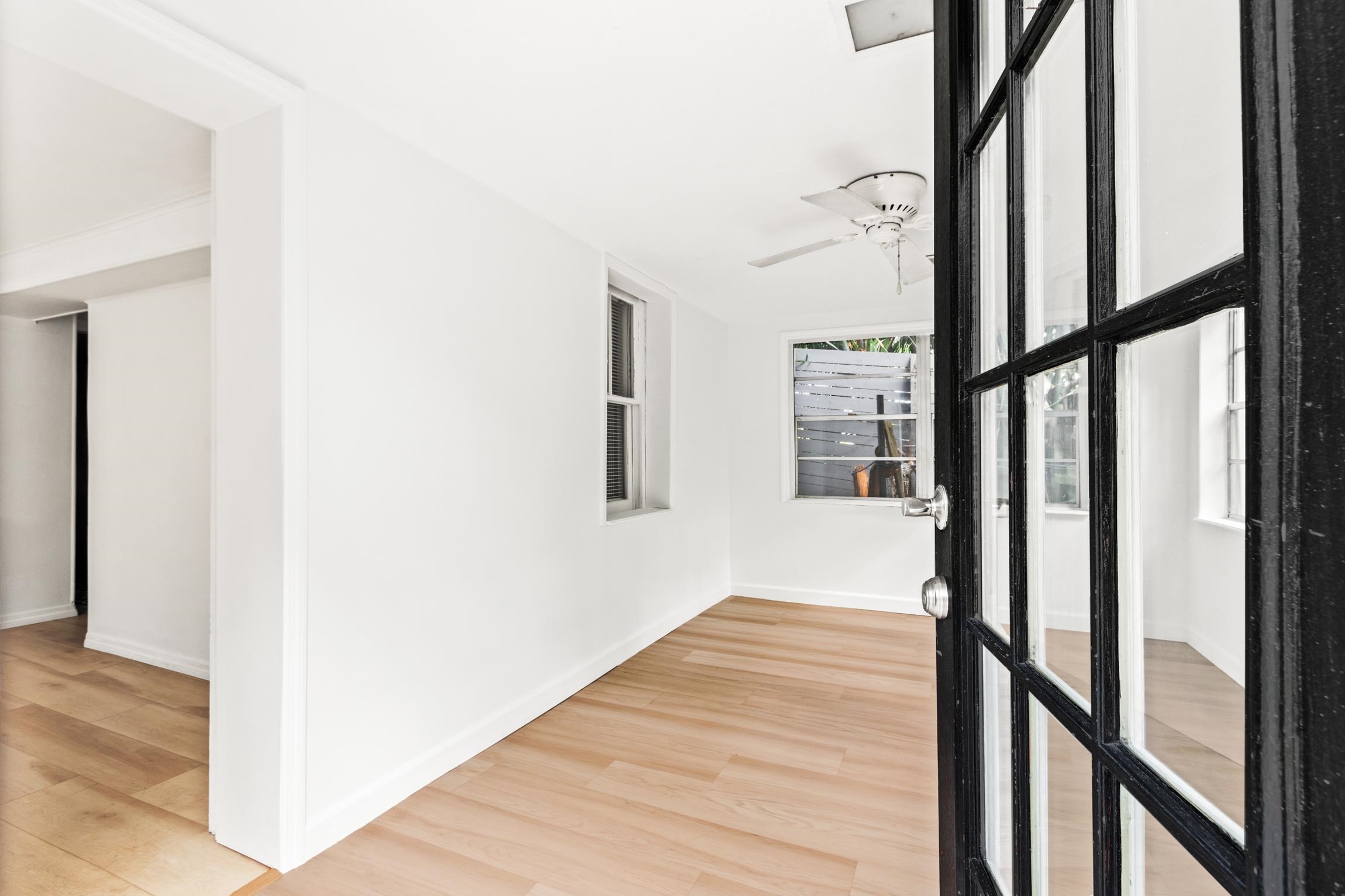 26 Ponce De Leon Avenue St. Augustine, FL 32080 - Photo 21 of 51 a view of a hallway with wooden floor and staircase