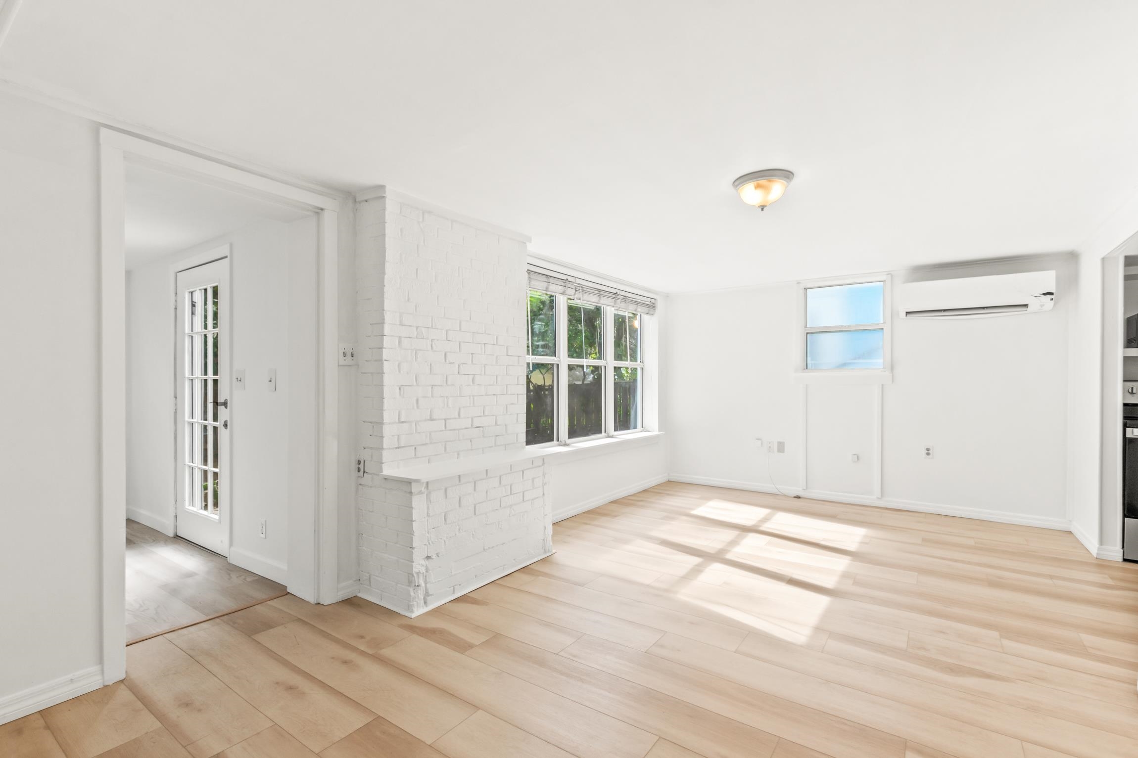 26 Ponce De Leon Avenue St. Augustine, FL 32080 - Photo 28 of 51 a view of an empty room with wooden floor and a window