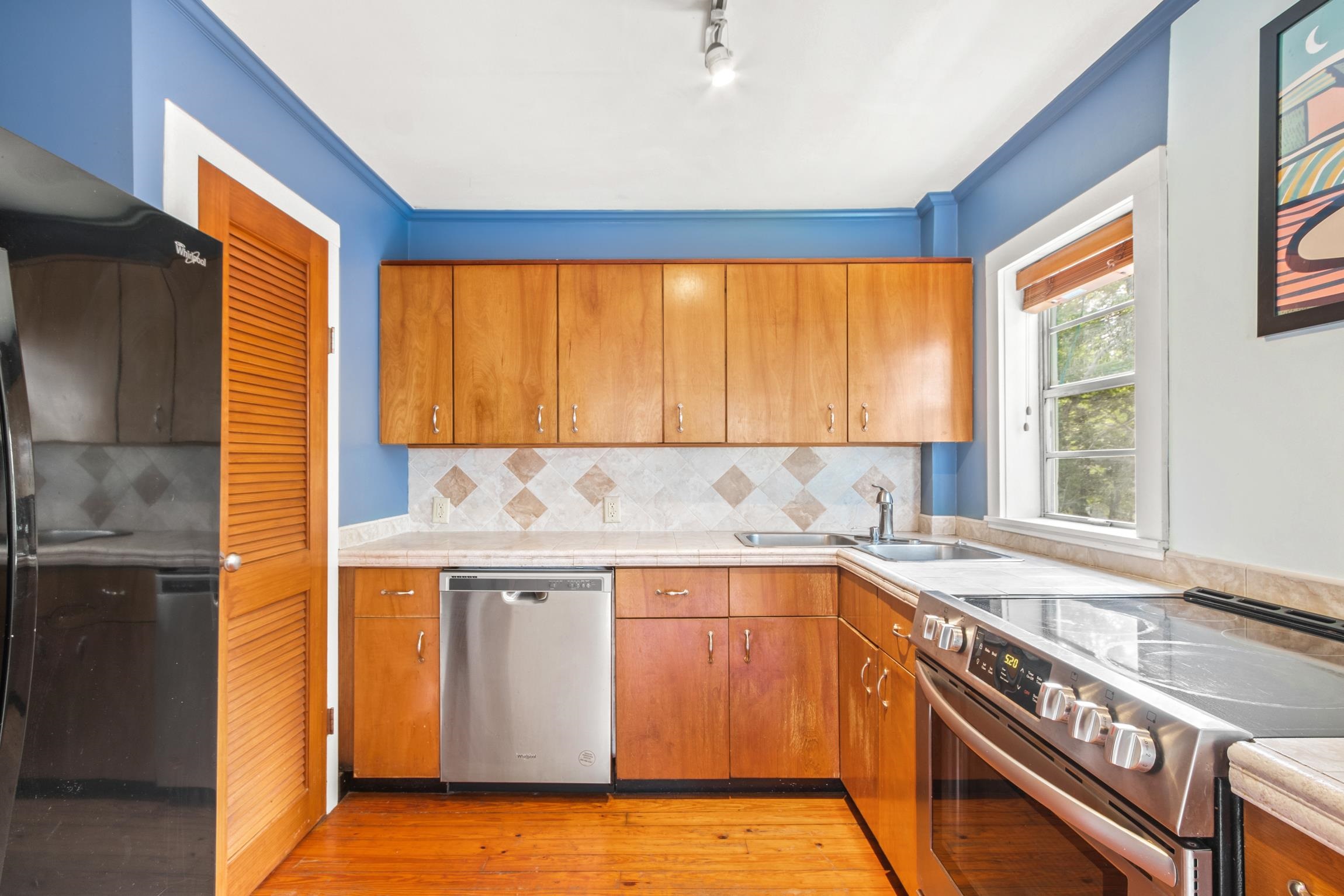 26 Ponce De Leon Avenue St. Augustine, FL 32080 - Photo 6 of 51 a kitchen with a sink stove and cabinets