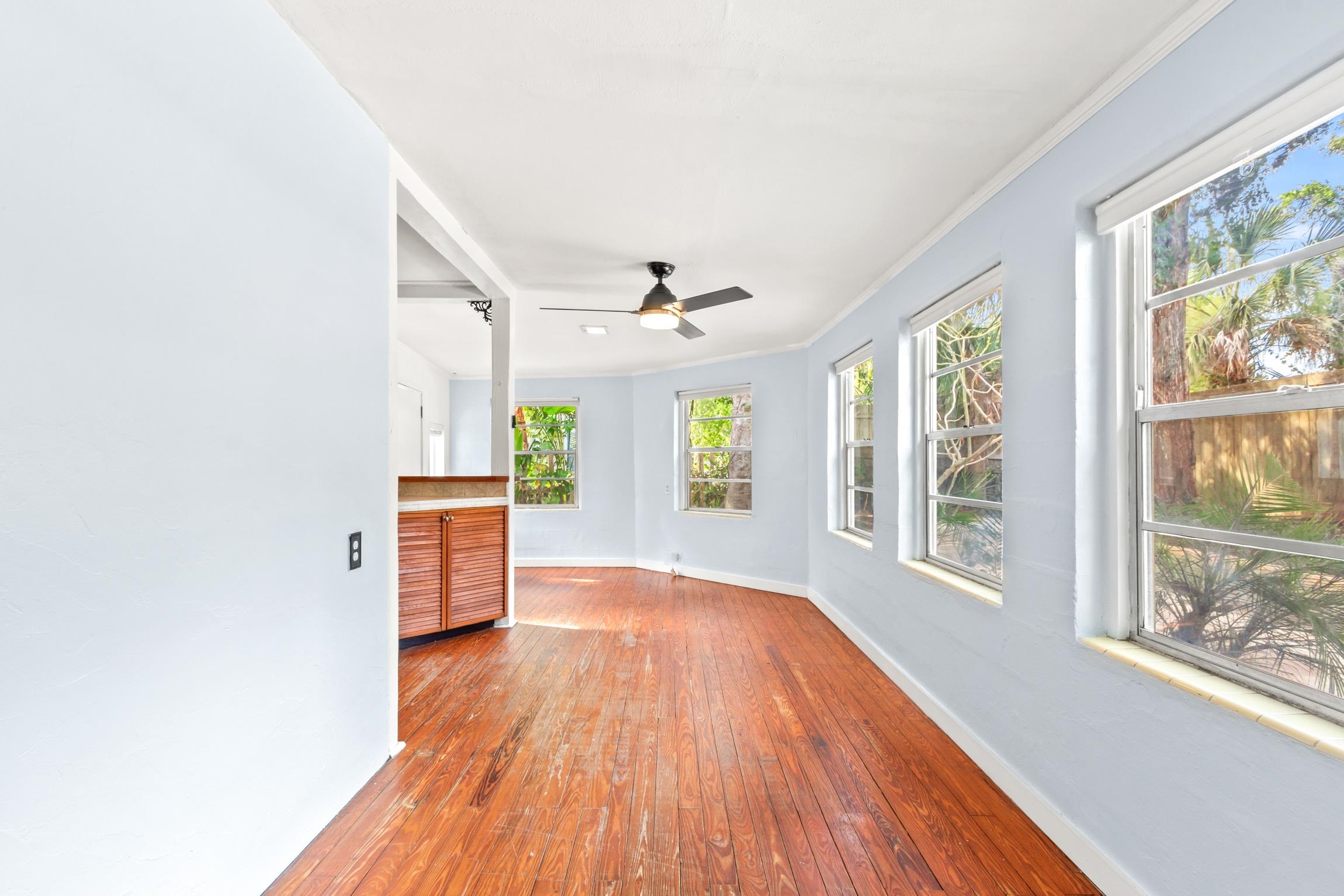 26 Ponce De Leon Avenue St. Augustine, FL 32080 - Photo 9 of 51 a view of an empty room with a window and wooden floor