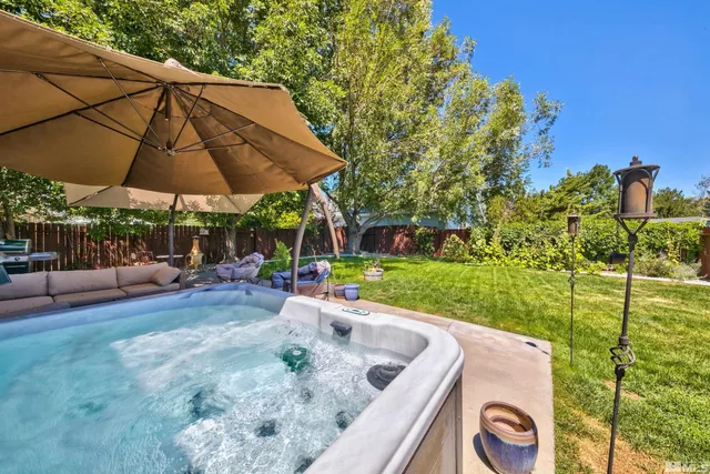 a view of a backyard with sitting area and furniture