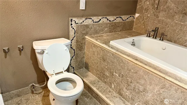 a bathroom with a toilet and a sink