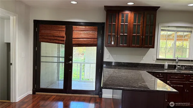 a kitchen with kitchen island a counter top space and a sink