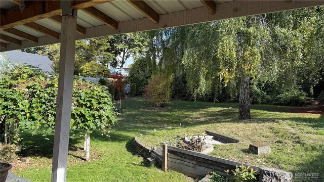 a view of a wooden deck with a yard