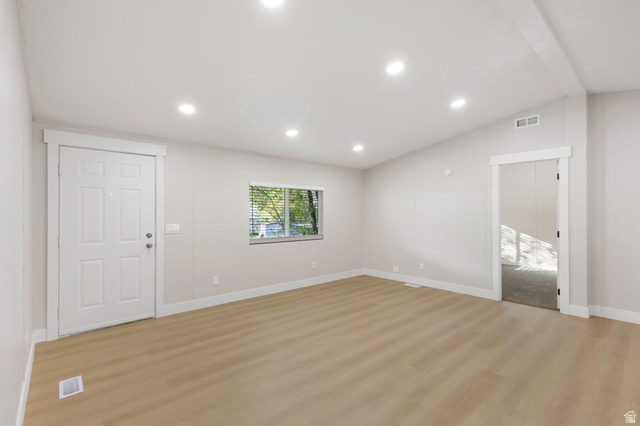 96 Barrington Way Layton, UT 84041 - Photo 5 of 28 Unfurnished living room with light wood finished floors, lofted ceiling, and recessed lighting
