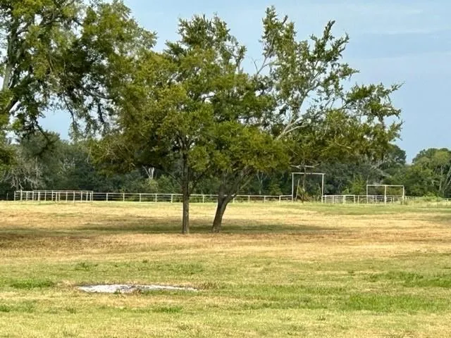 a view of a swimming pool with an outdoor space and seating area