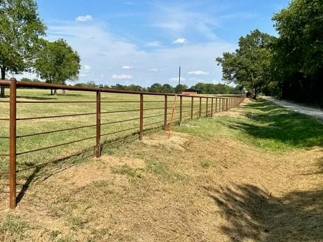 a view of swimming pool with a yard