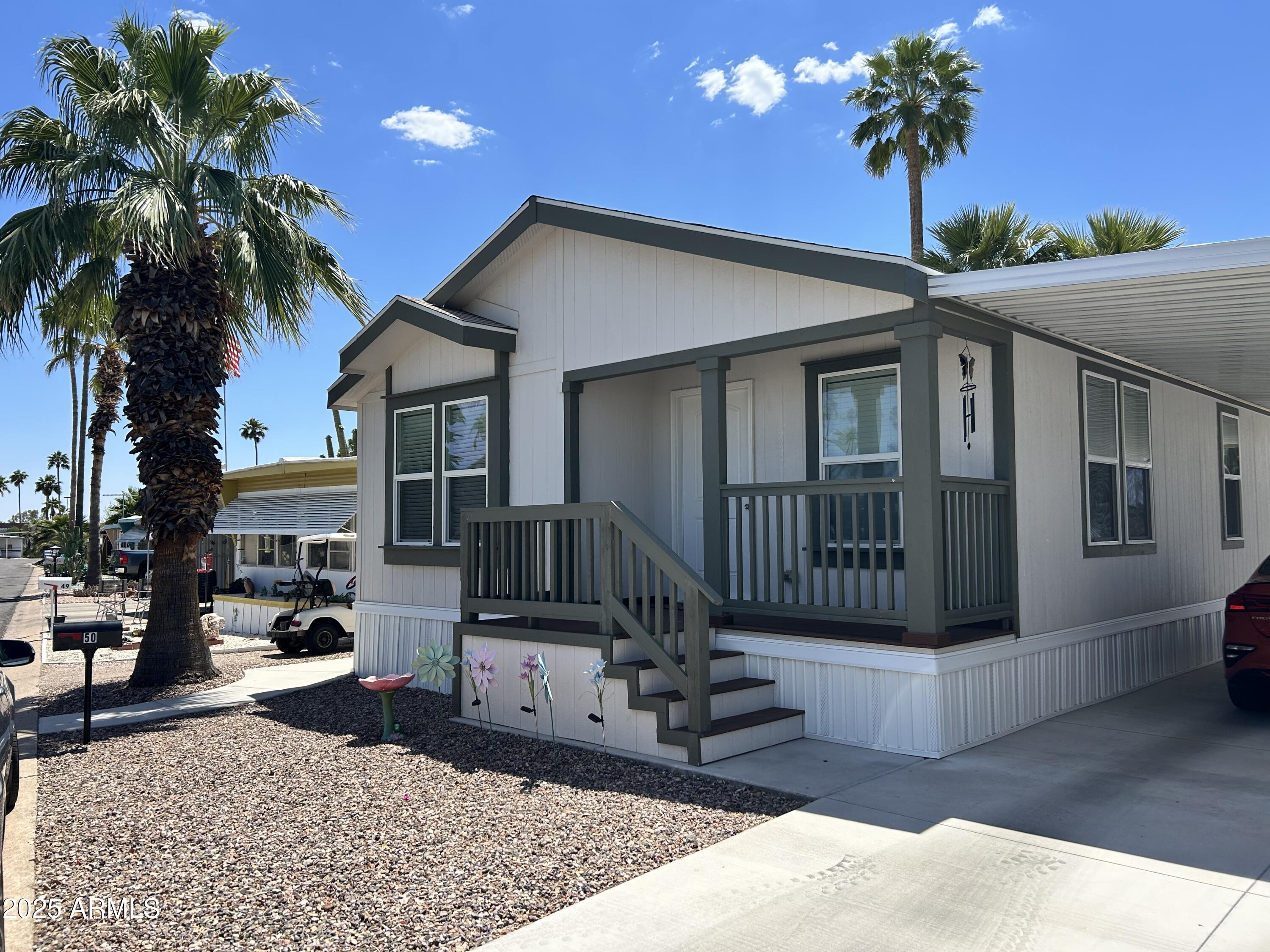 10540 East Apache Trail, Unit 50 Apache Junction, AZ 85120 - Photo 1 of 32 a view of a house with a patio