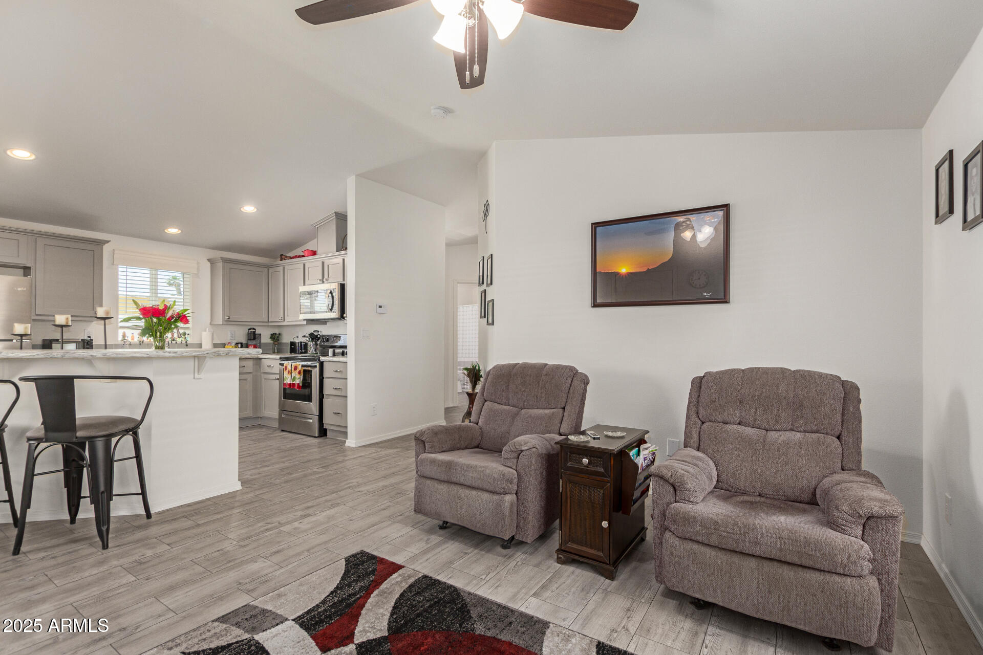 10540 East Apache Trail, Unit 50 Apache Junction, AZ 85120 - Photo 12 of 32 a living room with furniture and kitchen view