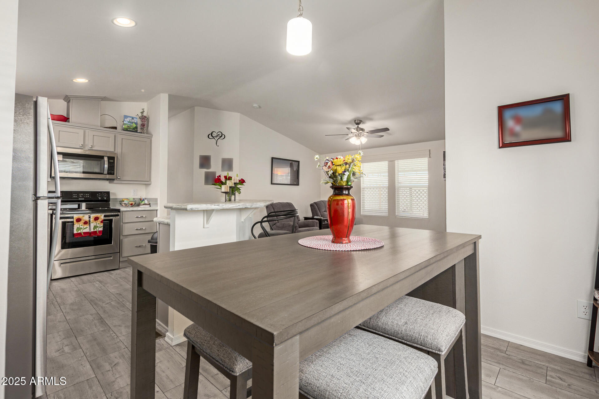 10540 East Apache Trail, Unit 50 Apache Junction, AZ 85120 - Photo 15 of 32 a living room with kitchen island furniture and a kitchen view