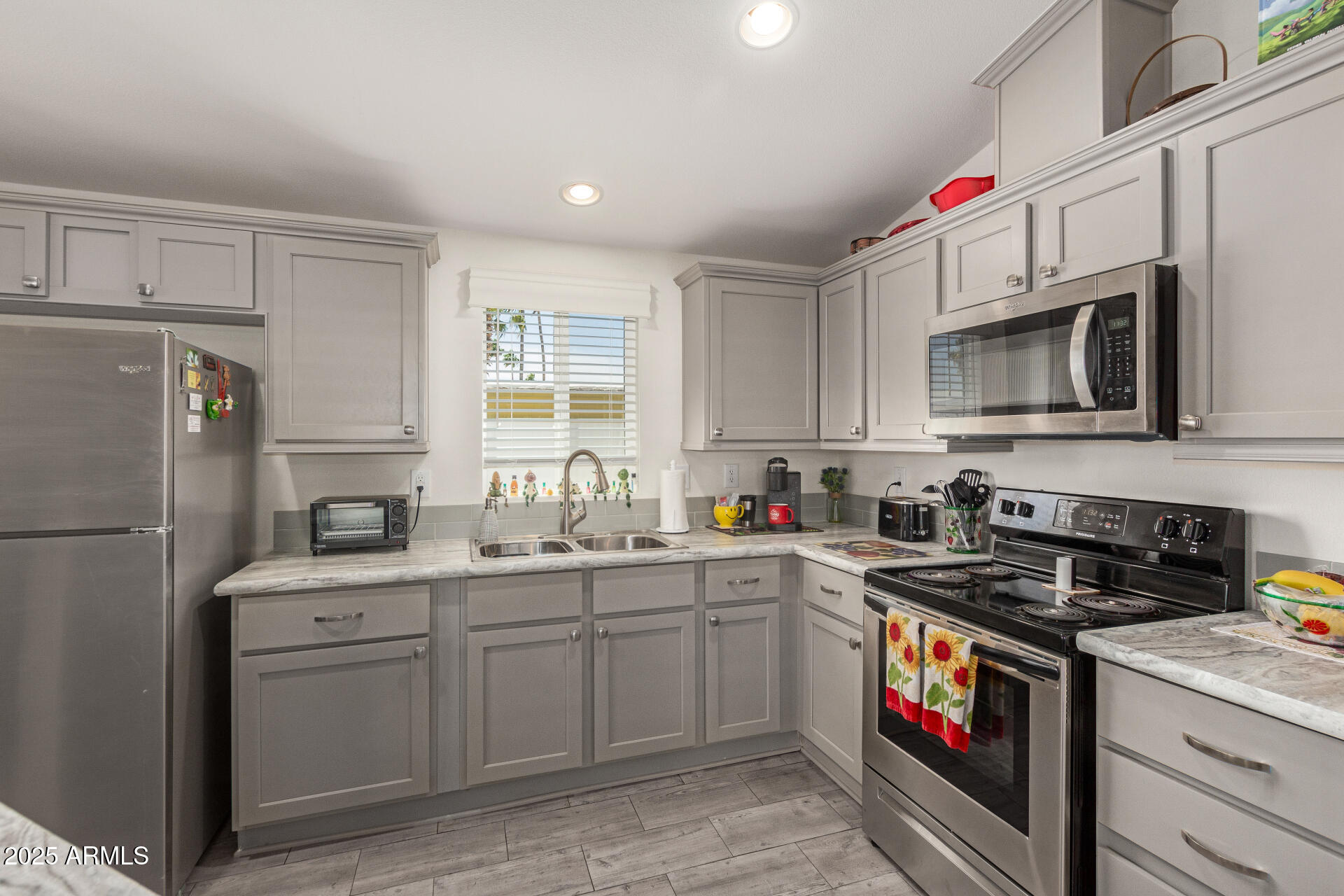10540 East Apache Trail, Unit 50 Apache Junction, AZ 85120 - Photo 16 of 32 a kitchen with a sink stove and refrigerator